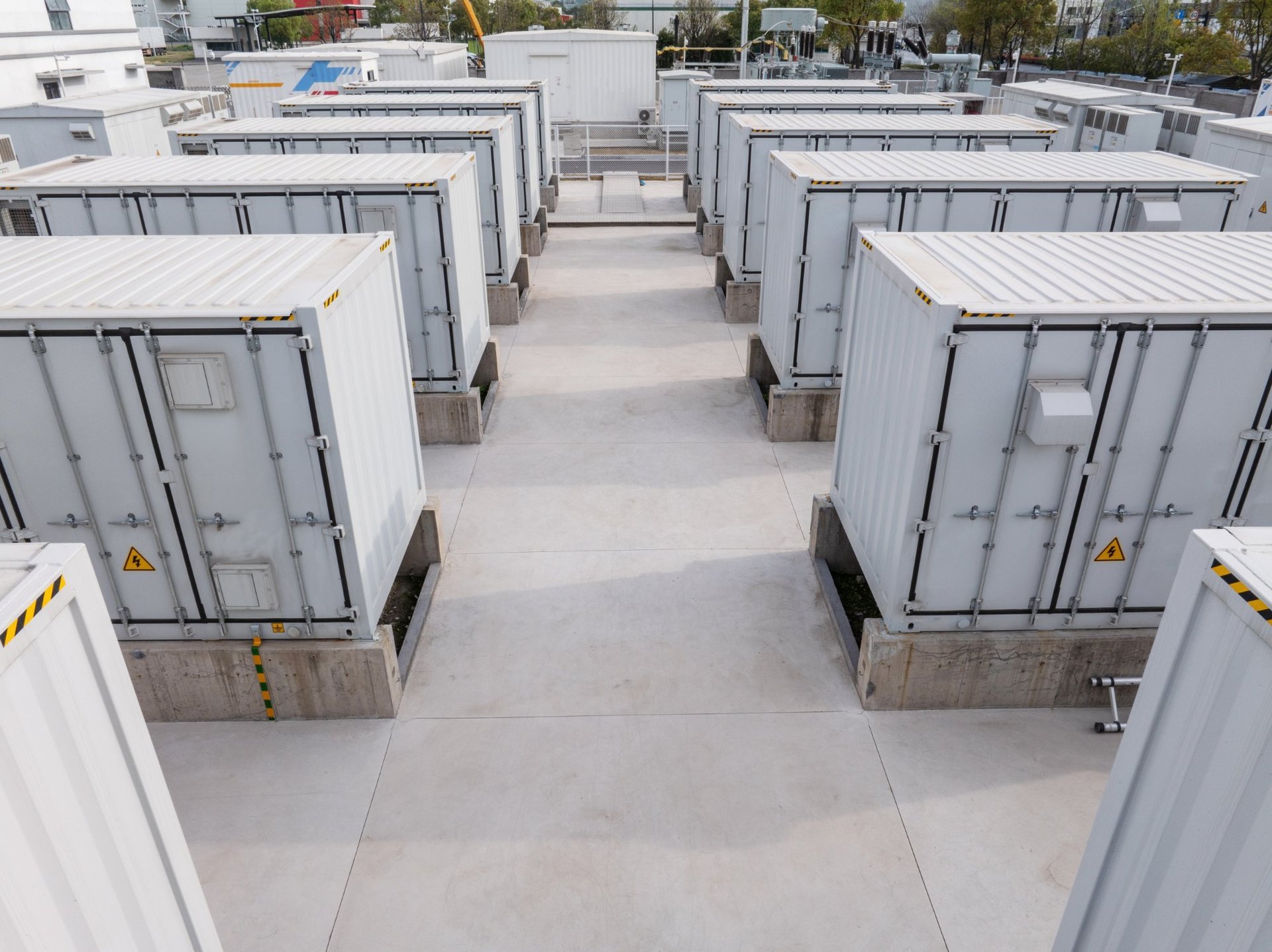 Rows of white battery energy storage containers viewed from above